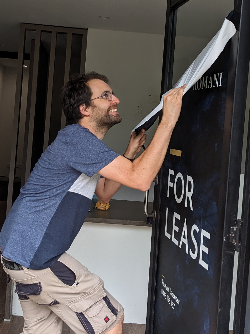 Jim removing the for lease sign